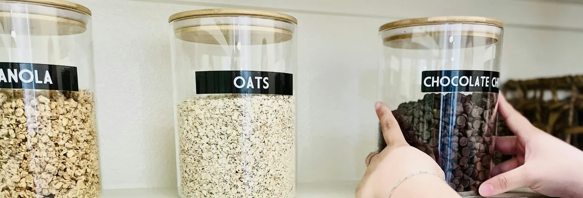 Labeled containers on a shelf