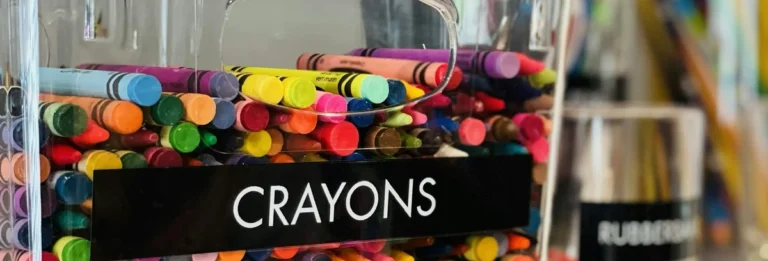 Clear bins with crayons